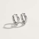 1cm rounded shape hypoallergenic huggie earrings in silver on white background