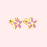 Gold flower-shaped earrings with pink centers on a light pink background