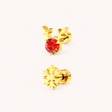 A gold Christmas set with a pair of Rudolph sparkle and snowflake flat back earrings on a whyite background.