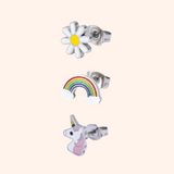 Set of three earrings: a daisy, rainbow, and unicorn on a light pink background