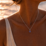 Woman wearing the Silver Classic Cushion Stone Necklace with an amethyst gemstone.