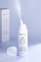 STERIPERIENCE piercing aftercare spray with packaging on a light blue background