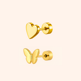 Gold heart and butterfly earrings on a light pink background