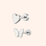 Heart and butterfly-shaped earrings on a light pink background