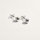 Ball hypoallergenic stud earrings in silver on white background