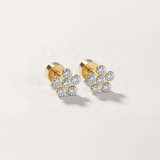 Cubic zirconia flower flat back stud earring in gold on white background.