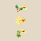 A set made up of three gold Christmas themed earrings on a beige background.