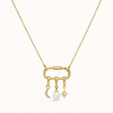 Gold necklace with a pendant featuring a pearl and star design on a white background