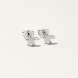Mini star hypoallergenic earrings in silver on white background