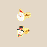 Gold Christmas set with snowman and father Christmas earrings on a beige background.