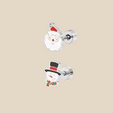 Silver Christmas set with snowman and father Christmas earrings on a beige background.