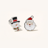 Silver Christmas set with snowman and father Christmas earrings on a beige background.