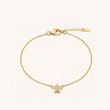 Gold bracelet with a star-shaped charm on a white background