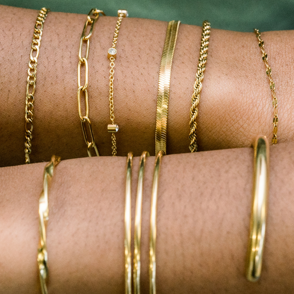 Stacked gold bracelets
