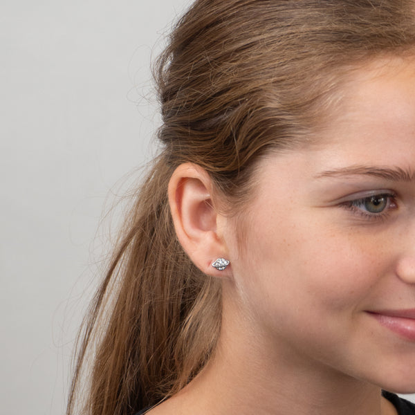 Girl wearing the planet earring.