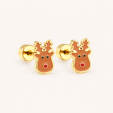 Pair of gold reindeer earrings on a light pink background.