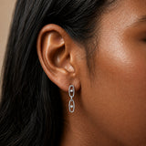Close-up of model wearing Silver Crystal Link Drop Earrings with two oval links and clear cubic zirconia stones