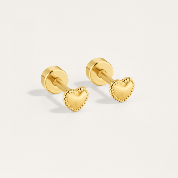 Bead trim heart hypoallergenic flat back stud earring in gold on white background
