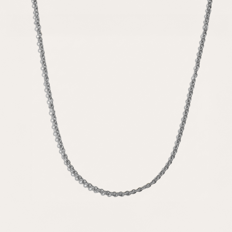 Delicate necklace in silver on white background
