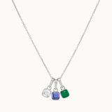 Necklace with three colored gemstones on a white background.