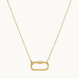 Gold necklace with a carabiner pendant on a white background