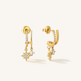 A pair of gold illusion style stud earrings with a cubic zirconia star and a plain crystal gem.