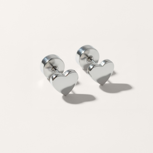 Heart flat back stud earring in silver on white background
