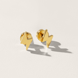 Mini lightning hypoallergenic flat back earrings in gold on white background
