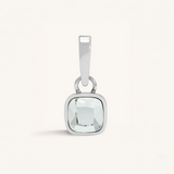 Silver pendant with a clear gemstone on a white background
