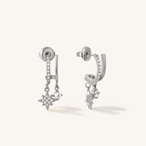 A pair of silver illusion style stud earrings with a cubic zirconia star and a plain crystal gem.