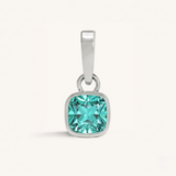 Silver pendant with a turquoise gemstone on a white background.