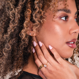 woman wearing two rings 